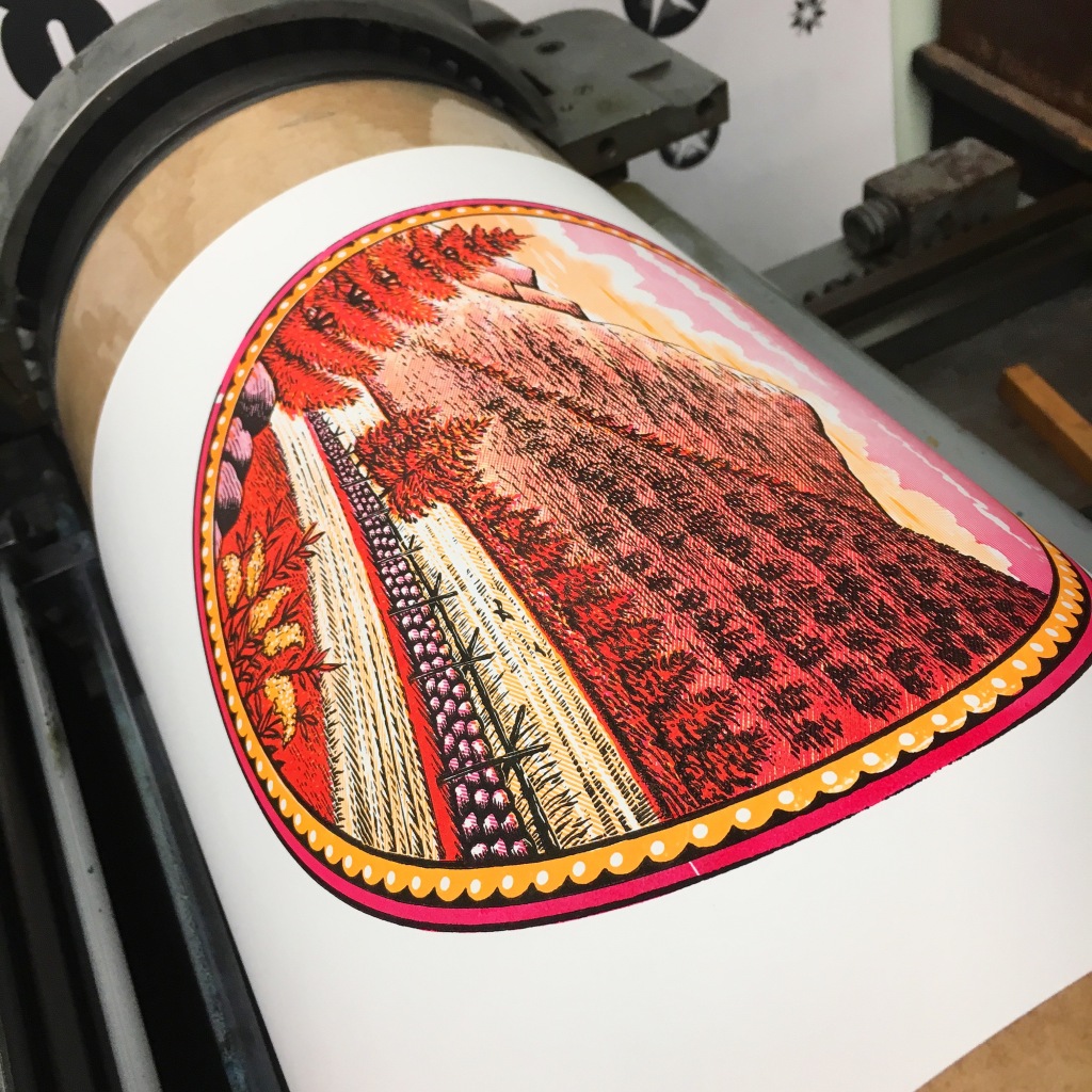 Three color print from antique wood engravings coming around the drum at the GramLee Collection at WVU - Morgantown, WV
